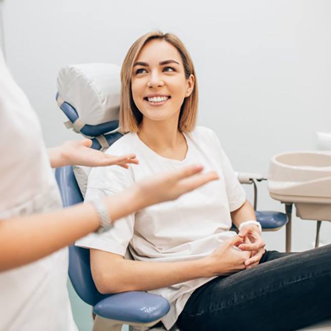 Patient smiles at dentist